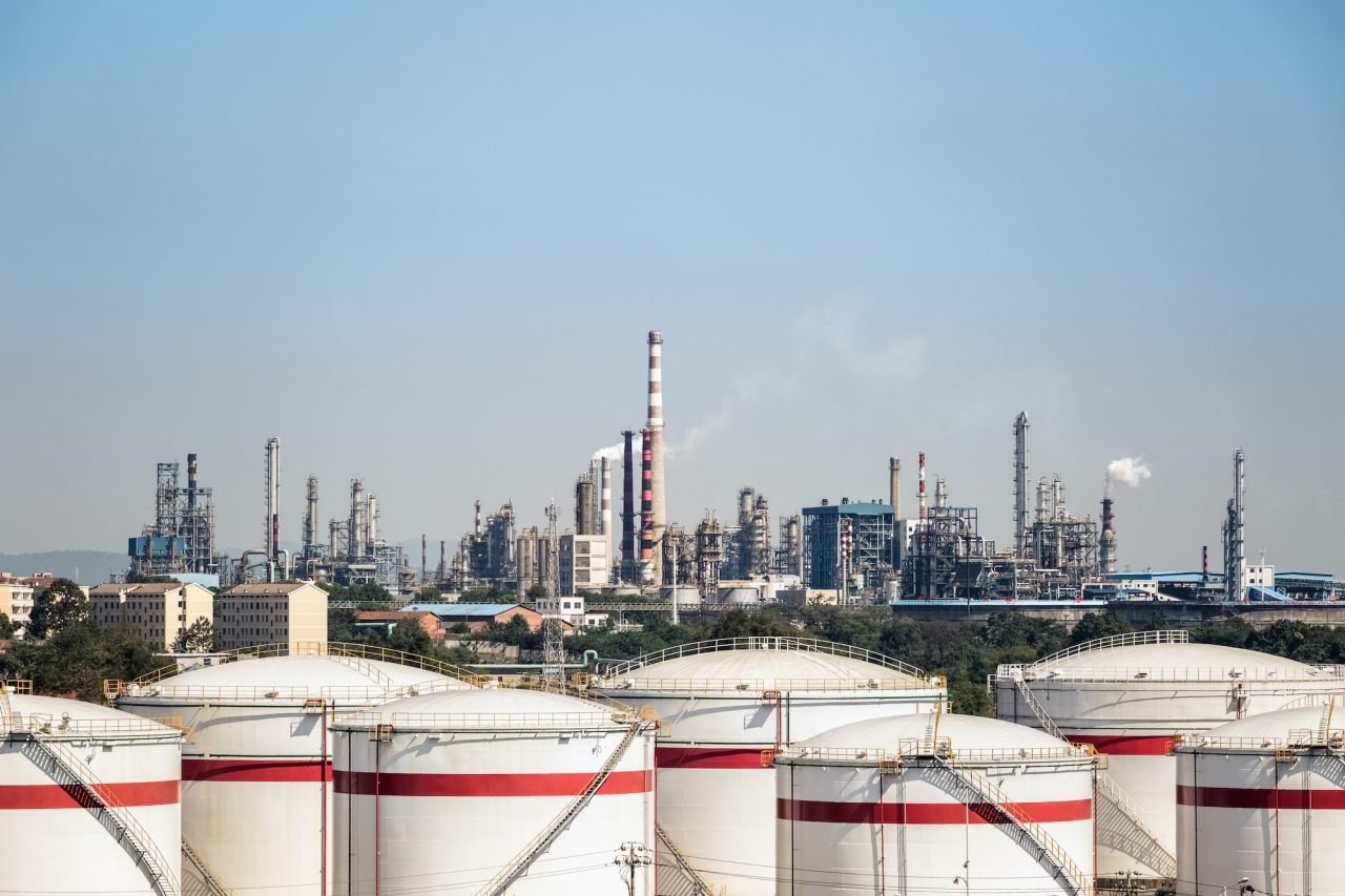 Petrochemical complex and storage tanks where lab presses test refinery and chemical samples