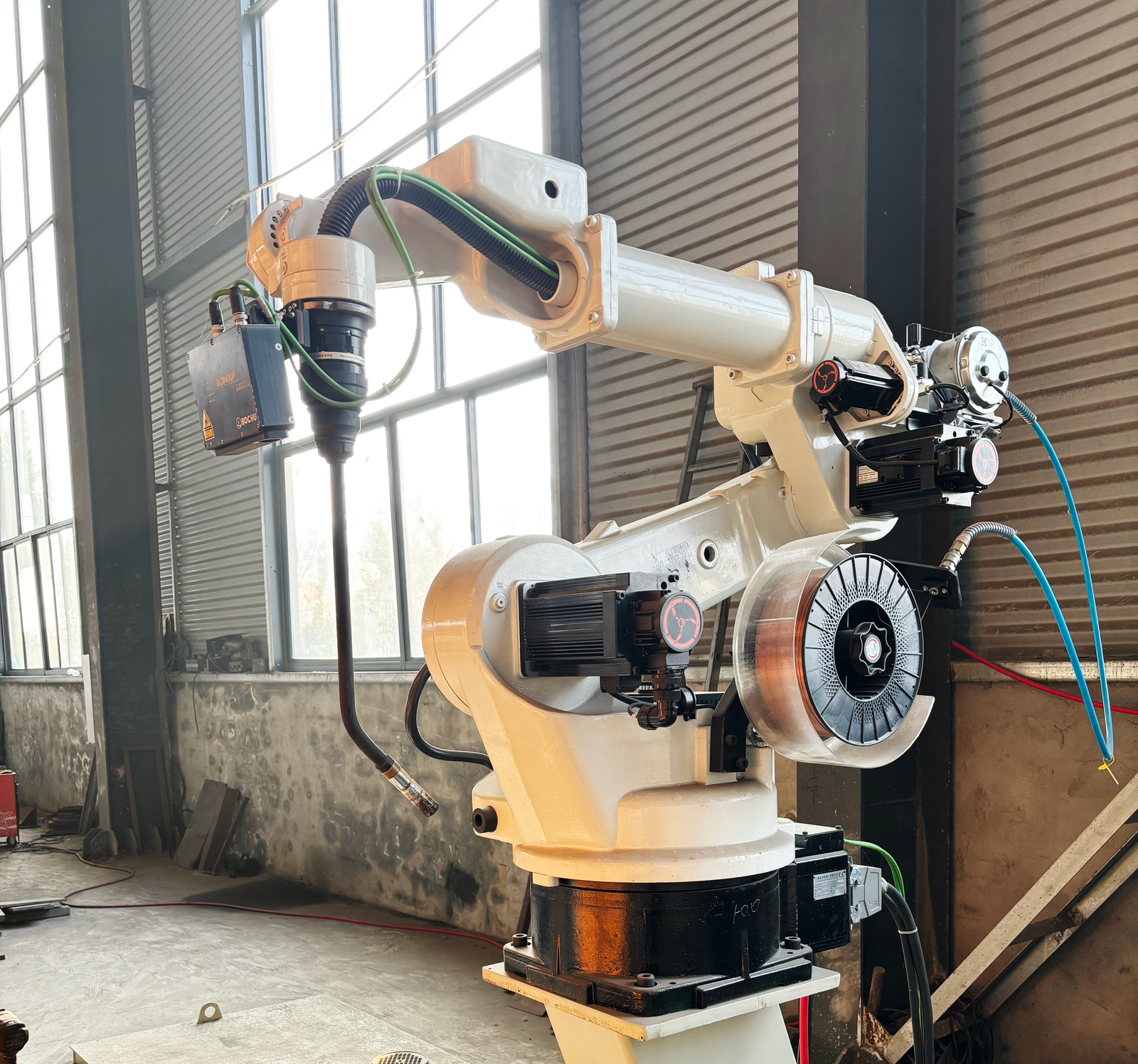Robotic welding arm on the Loway factory floor
