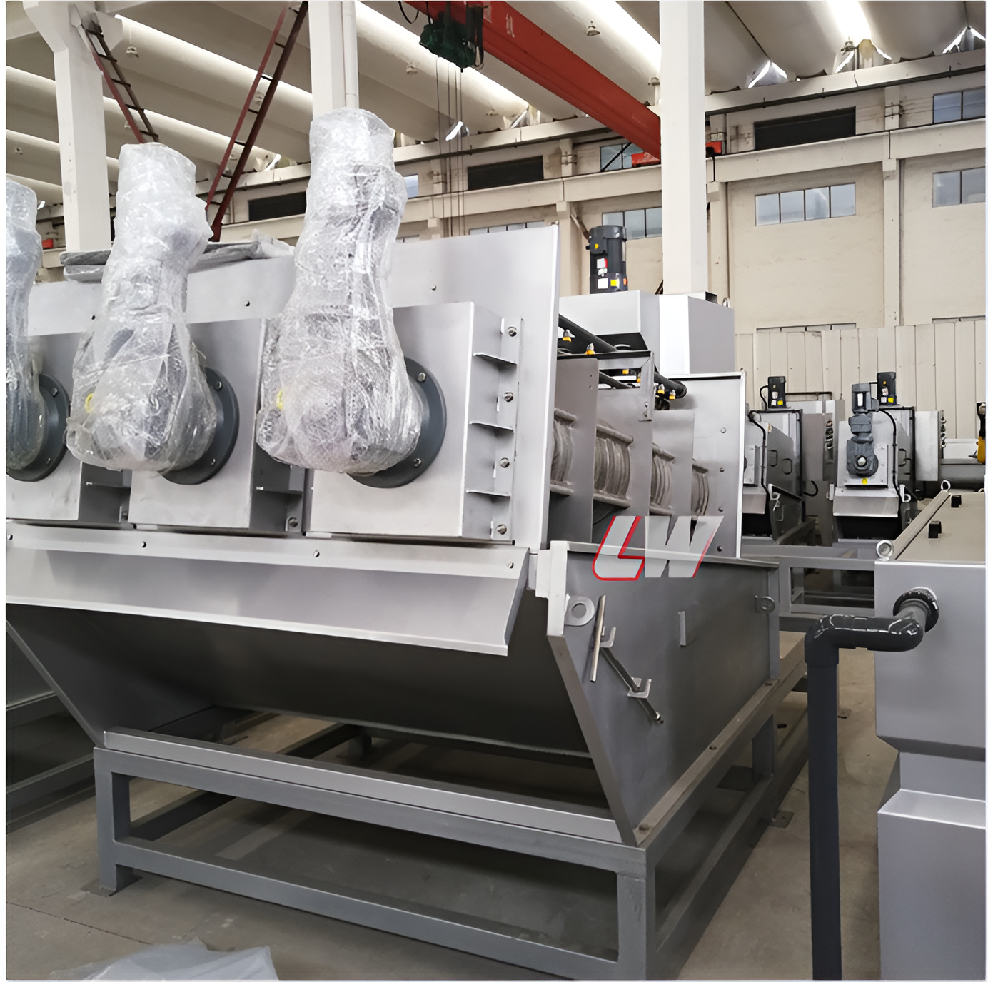 Multi-disc screw presses lined up in the Loway workshop