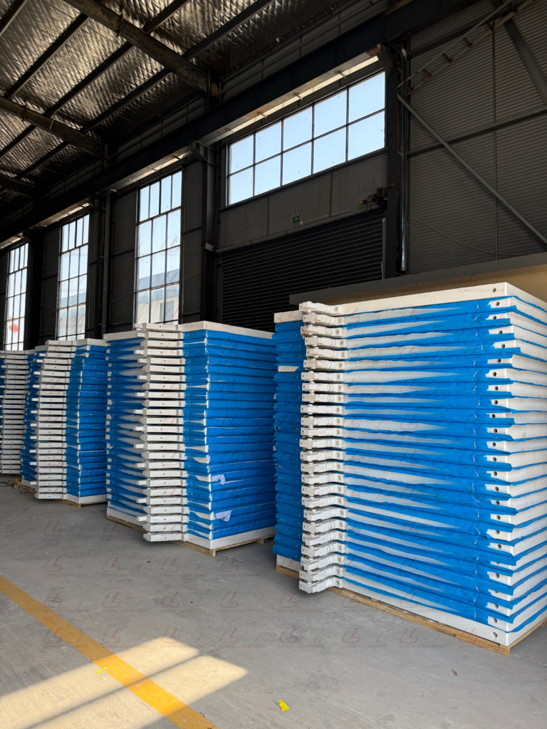 1000x1000mm chamber filter plates stacked in the Loway factory