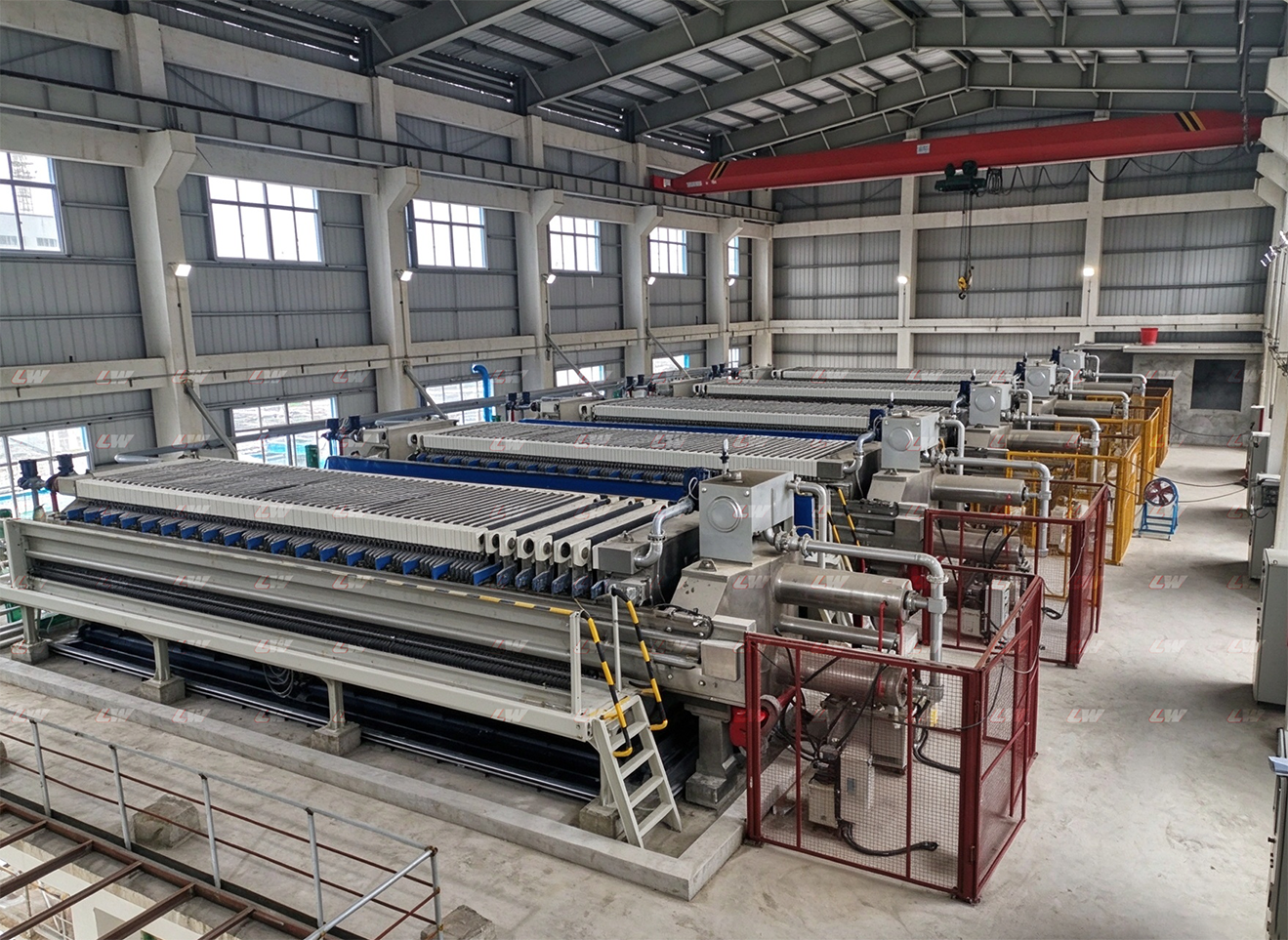 Several filter presses assembled in a workshop