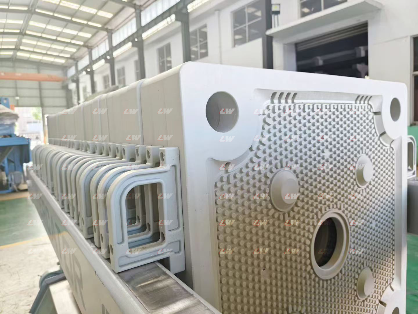 Chamber filter plates in a filter press at the Loway factory