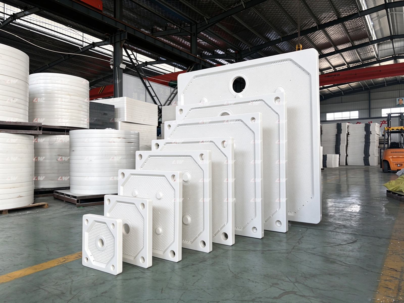 Filter plates stacked by size at the Loway factory