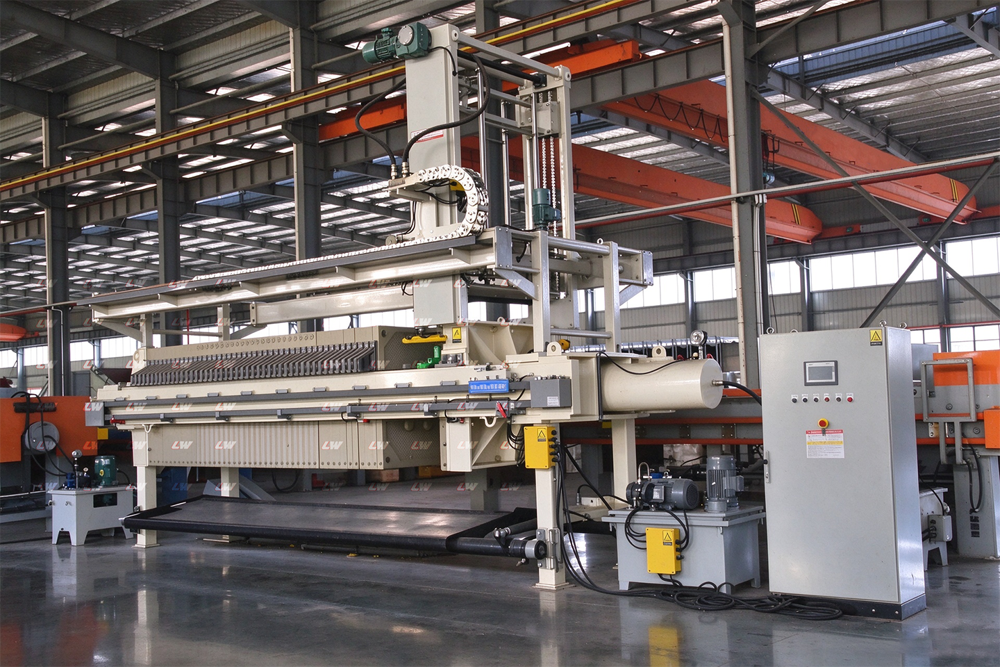 Fully automatic filter press with its control panel in the workshop